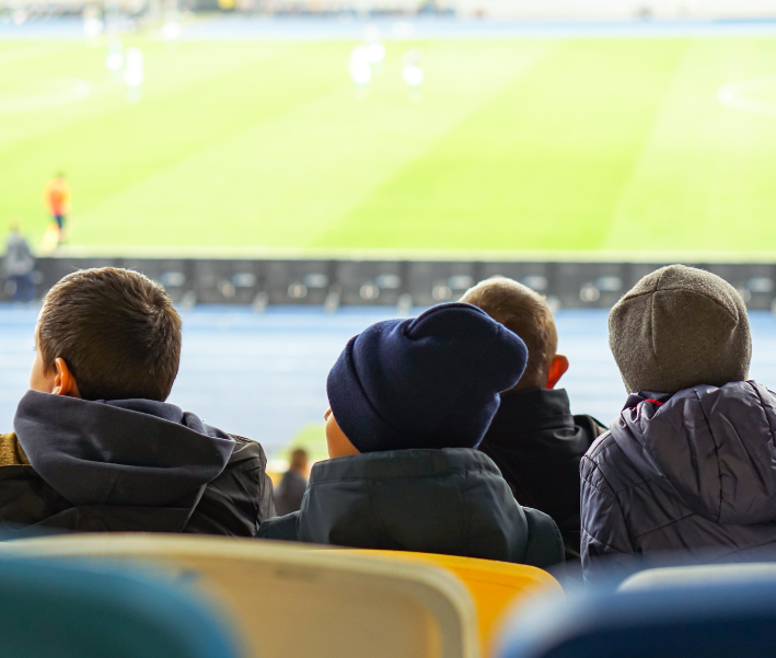 young fans watching a game